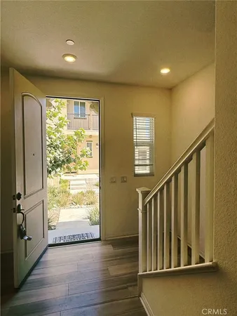 a view of entryway with wooden floor
