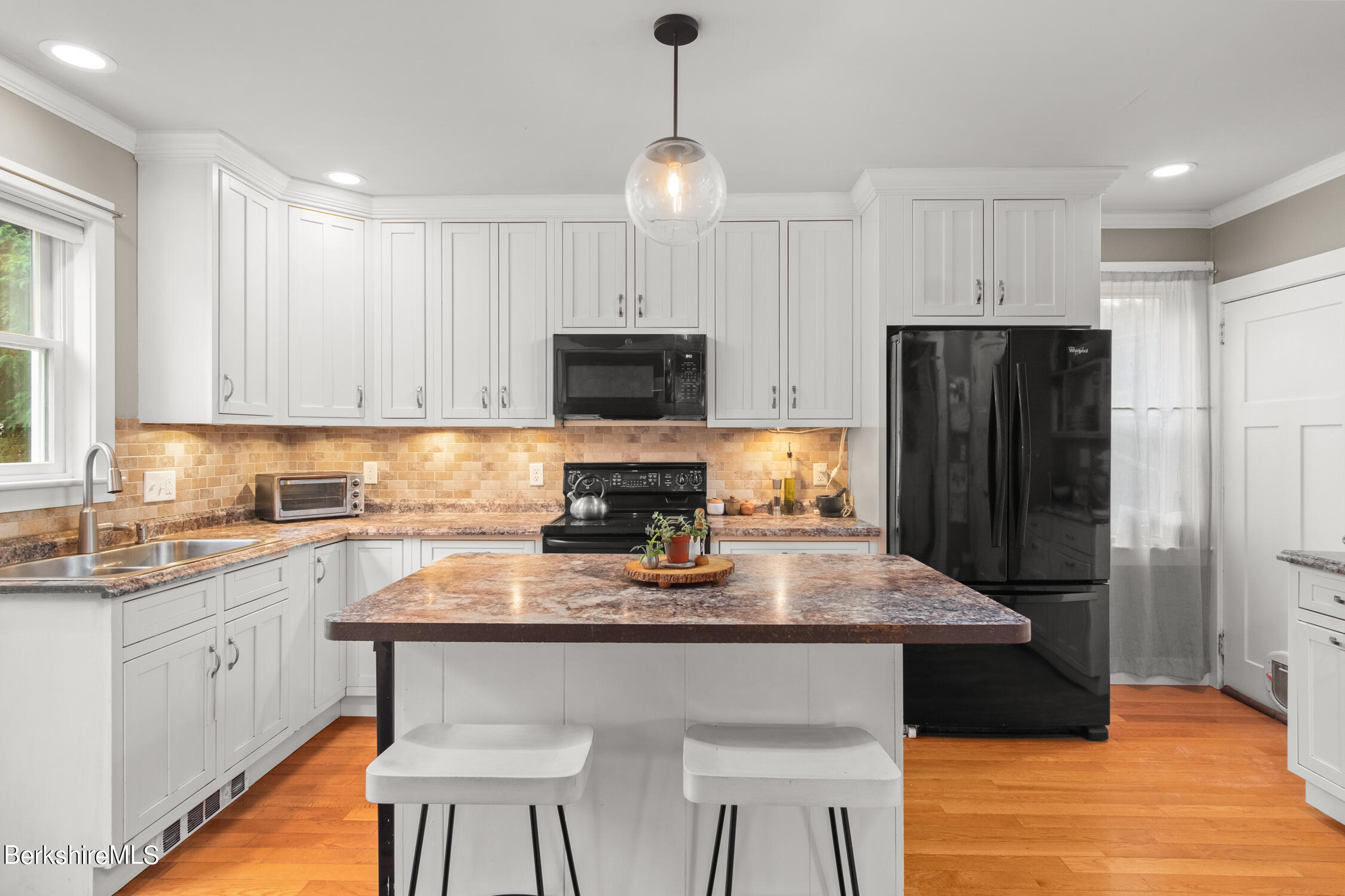 70 Notch Road North Adams, MA 01247 - Photo 2 of 22 a kitchen with refrigerator cabinets and wooden floor