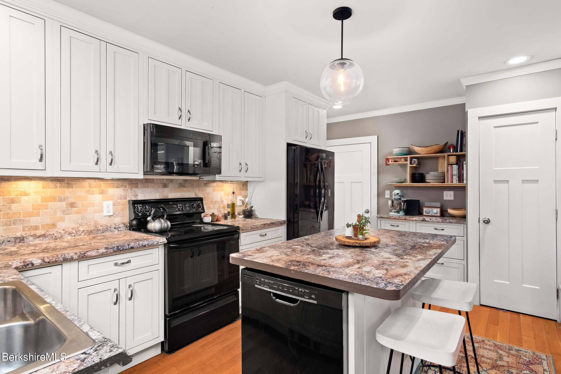 70 Notch Road North Adams, MA 01247 - Photo 4 of 22 a kitchen with kitchen island granite countertop a sink stove and refrigerator