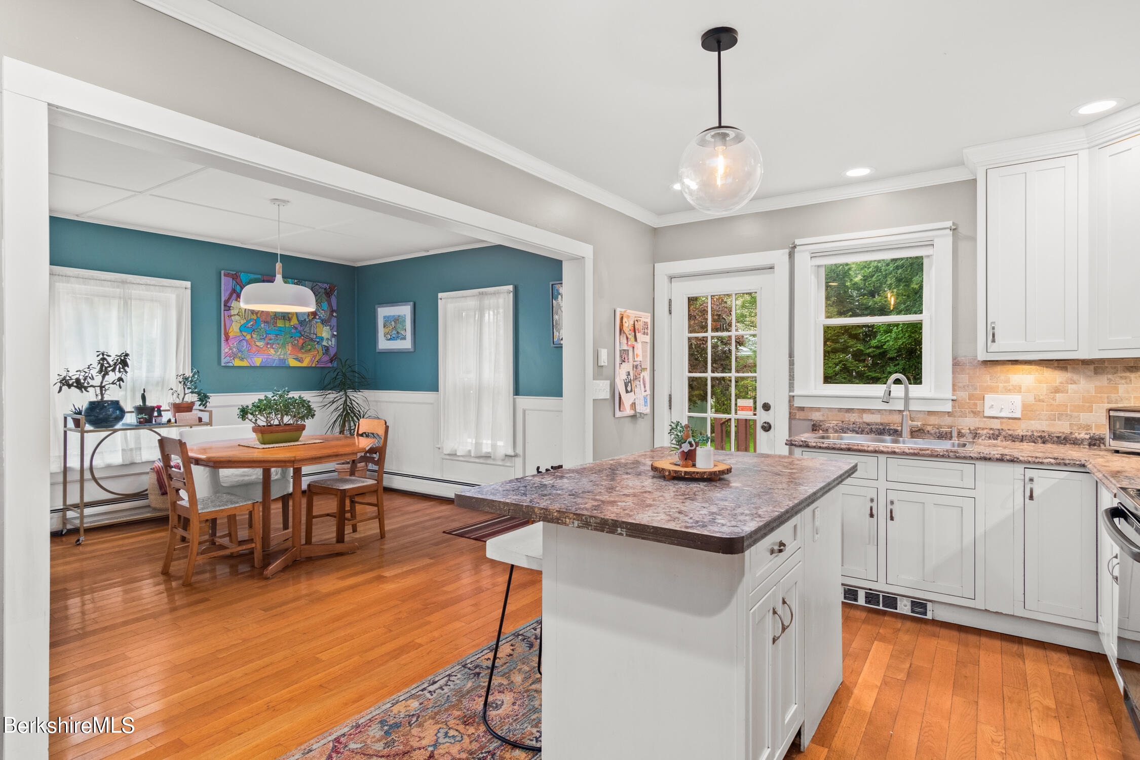 70 Notch Road North Adams, MA 01247 - Photo 6 of 22 a kitchen with granite countertop a stove a sink a dining table and chairs