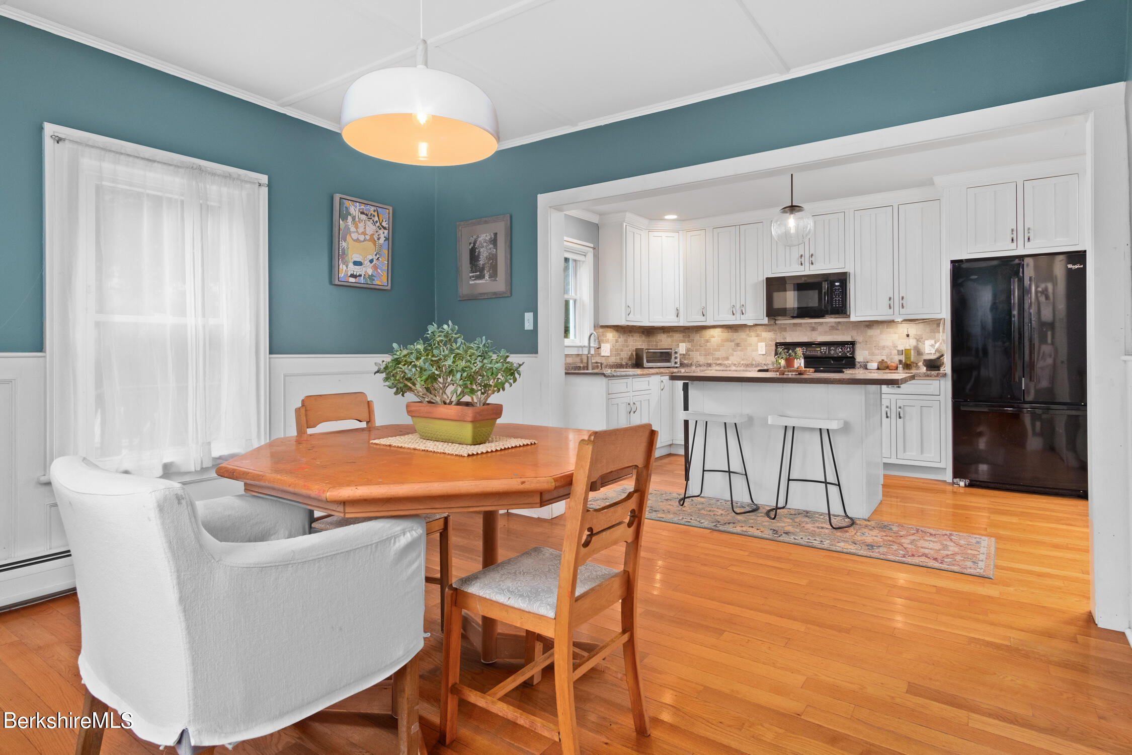 70 Notch Road North Adams, MA 01247 - Photo 8 of 22 a dining table with chairs and kitchen view