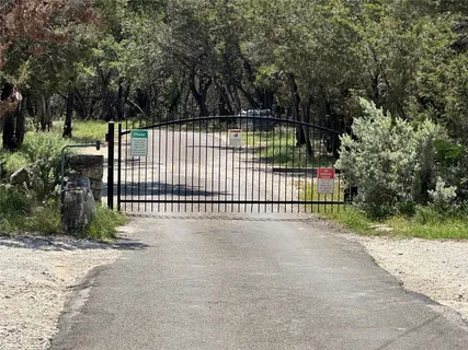 a view of a backyard with a street