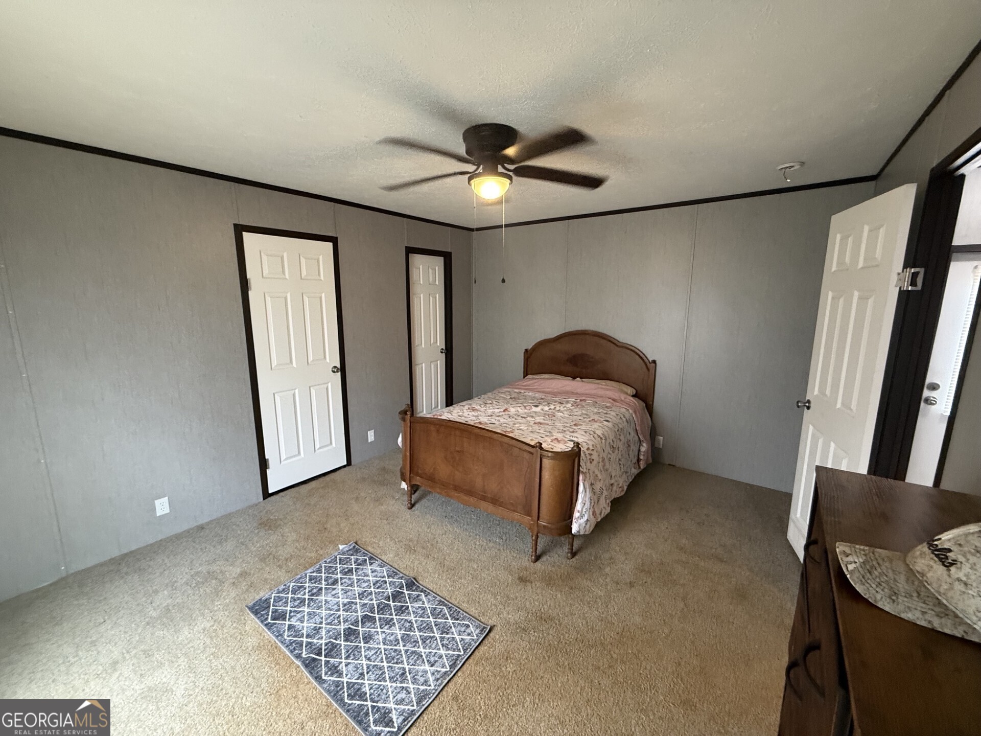50 Harvest Road Coleman, GA 39836 - Photo 28 of 37 a bedroom with a bed and a walk in closet