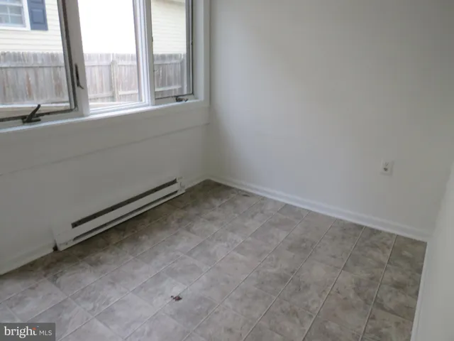 a view of a room that has a window in it