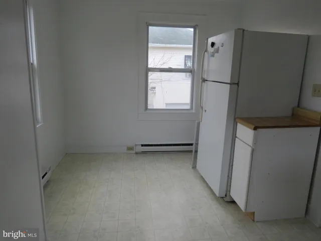 a view of a refrigerator in kitchen and a refrigerator