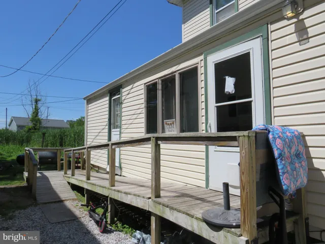 a balcony with view of nearby houses