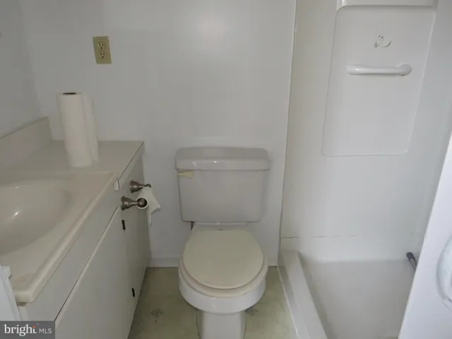 a bathroom with a toilet and a bathtub
