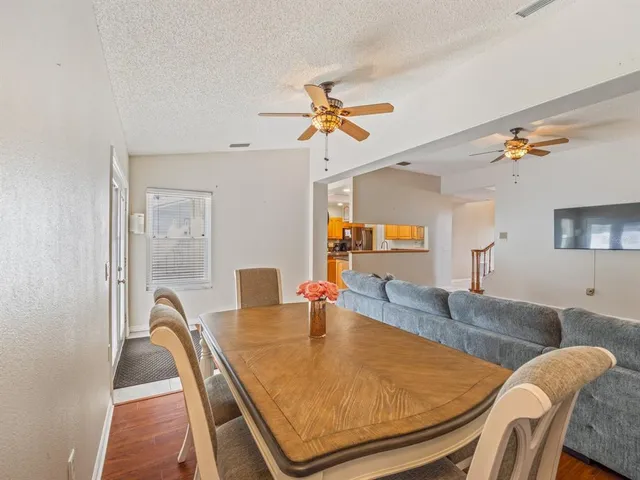 a dining room with furniture and window
