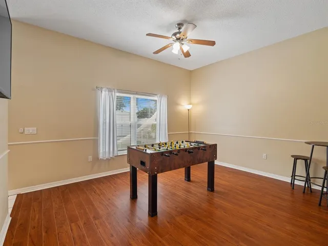 a view of a livingroom with furniture and wooden floor