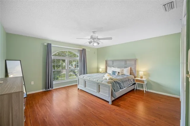 a bedroom with a bed and window