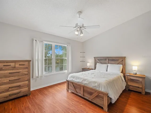 a bedroom with a bed and a dresser
