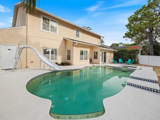 a view of a house with swimming pool