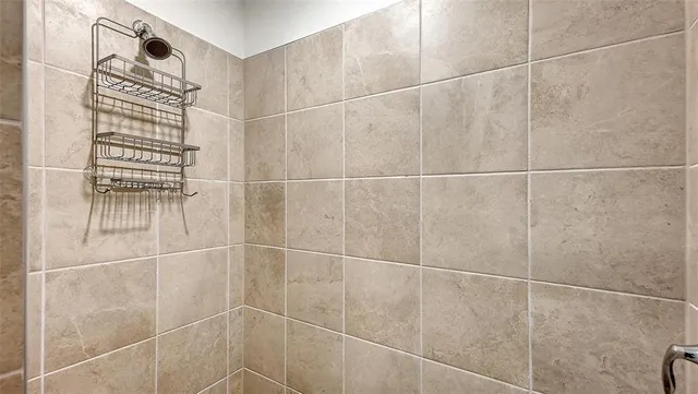 a view of a lake with houses in the back