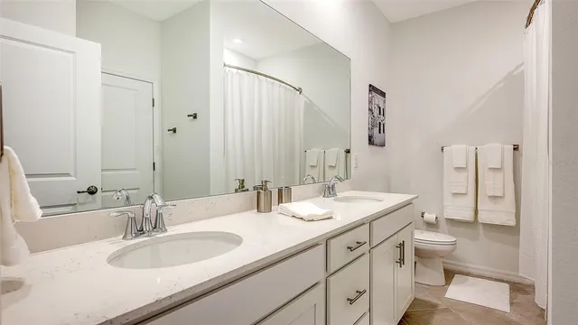 an aerial view of a house with a swimming pool patio and outdoor seating
