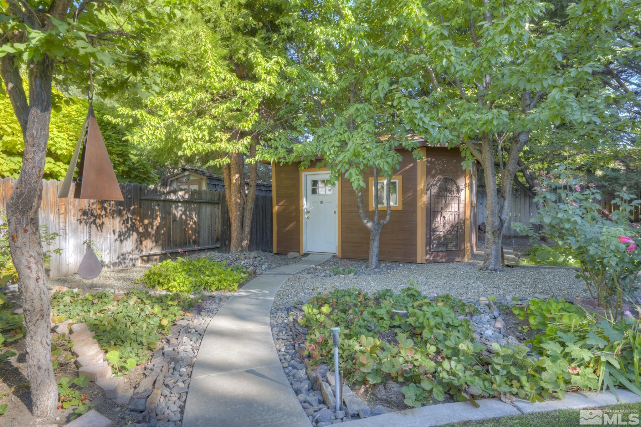 14095 Riata Circle Reno, NV 89521 - Photo 23 of 26 a view of a back yard with an tree and green space