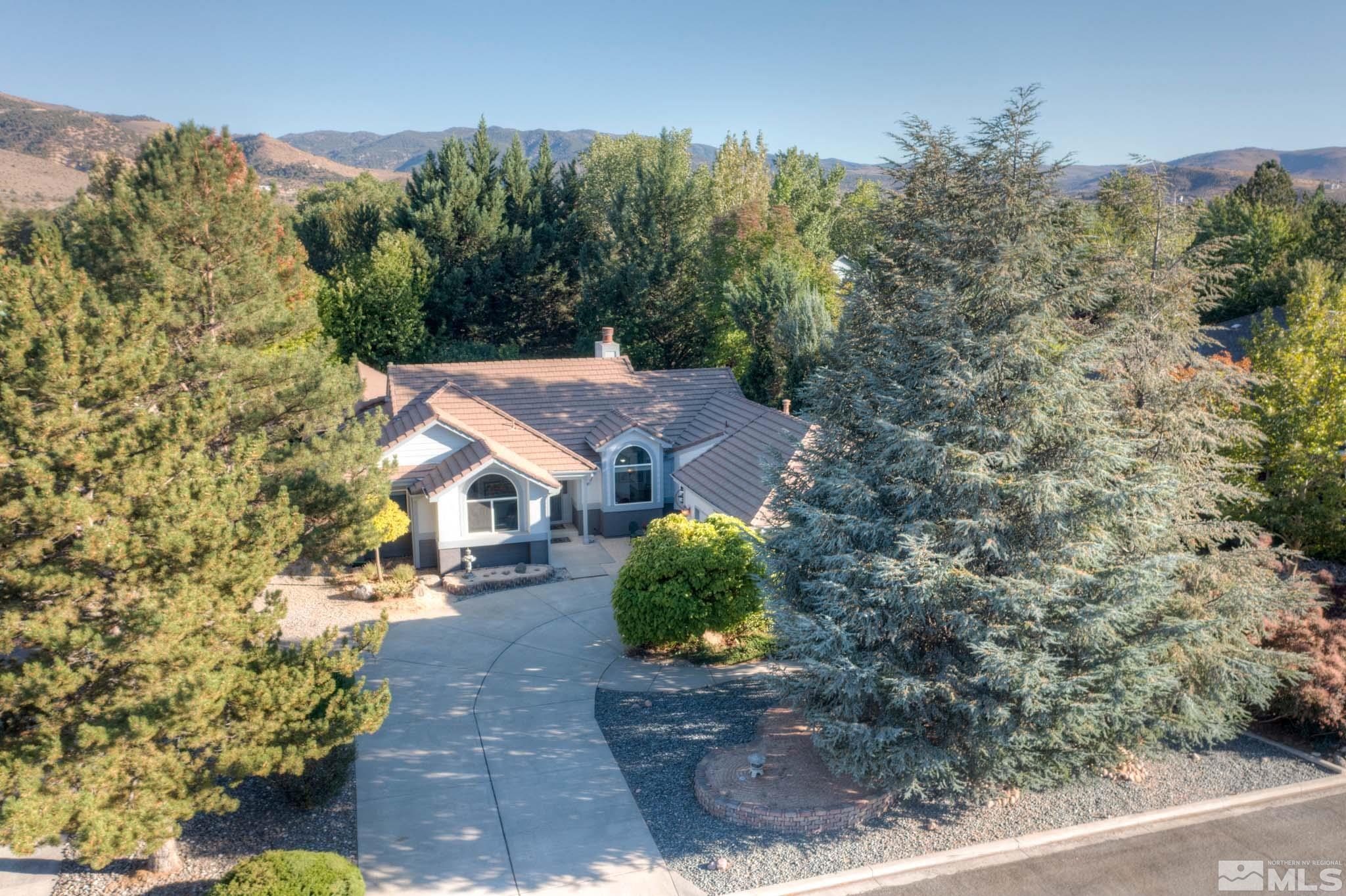 14095 Riata Circle Reno, NV 89521 - Photo 3 of 26 front view of a house with a yard