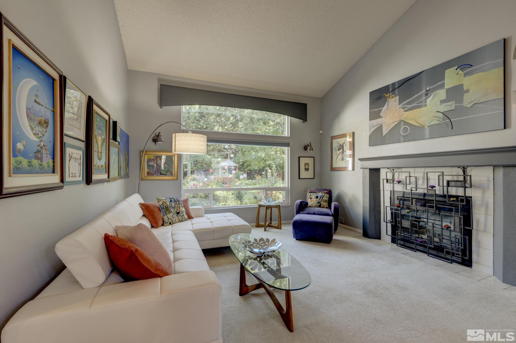 14095 Riata Circle Reno, NV 89521 - Photo 4 of 26 a living room with furniture and a fireplace