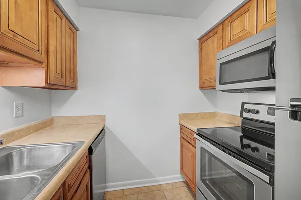 a kitchen with a sink and refrigerator