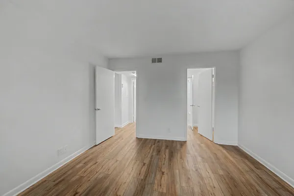 a bathroom that has a glass shower door
