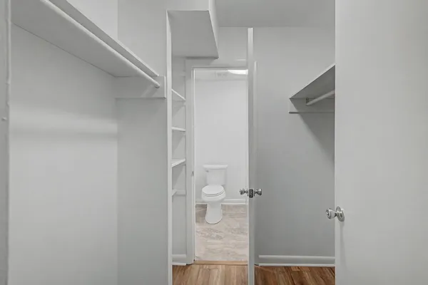 a view of hallway with wooden floor