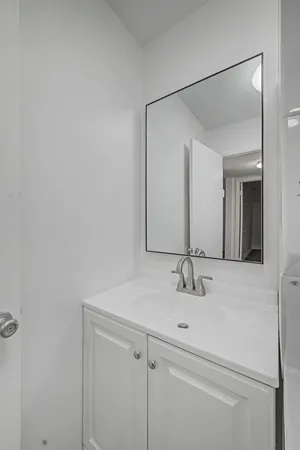 a view of a house with a yard and pathway