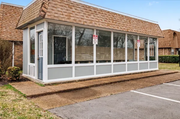 a view of a street with a building in the background