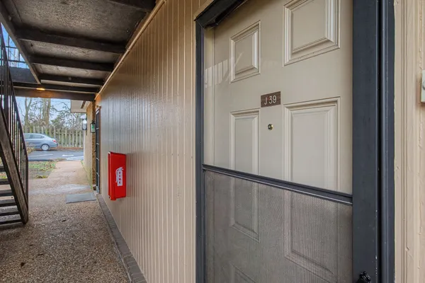 a view of a backyard with large trees