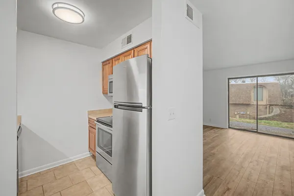 a kitchen with a sink cabinets and utility