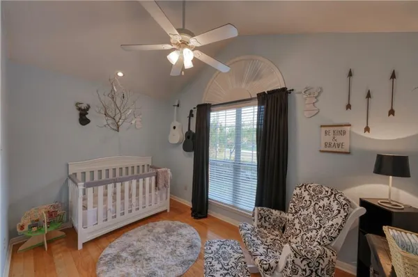 a bedroom with furniture and a window