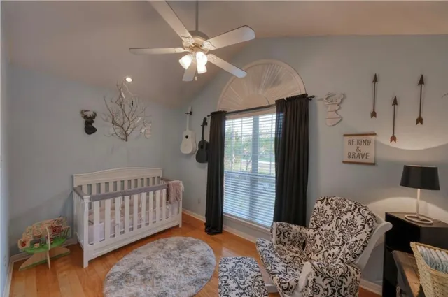 a bedroom with furniture and a window