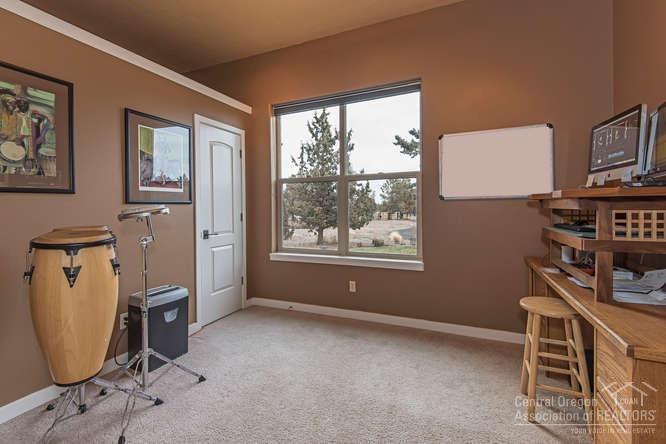 23095 Alfalfa Market Road Bend, OR 97701 - Photo 10 of 25 a view of a workspace with furniture and a window