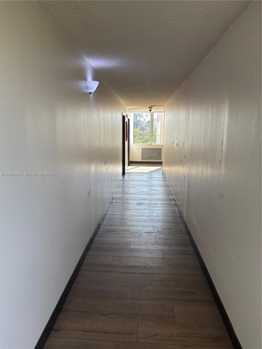 14250 Southwest 62nd Street, Unit 520 Miami, FL 33183 - Photo 21 of 39 a view of gallery with wooden floor
