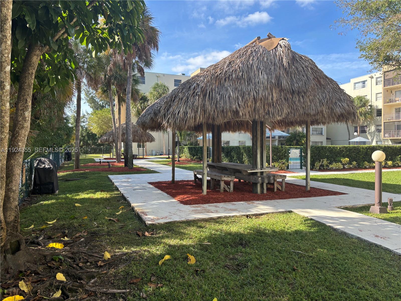 14250 Southwest 62nd Street, Unit 520 Miami, FL 33183 - Photo 26 of 39 a view of outdoor space yard deck patio and outdoor kitchen