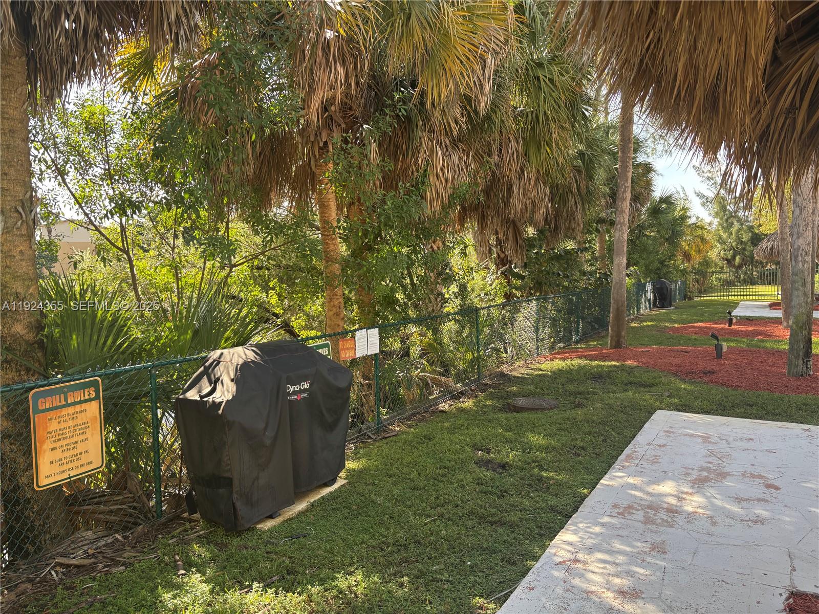 14250 Southwest 62nd Street, Unit 520 Miami, FL 33183 - Photo 28 of 39 a view of a park with large trees