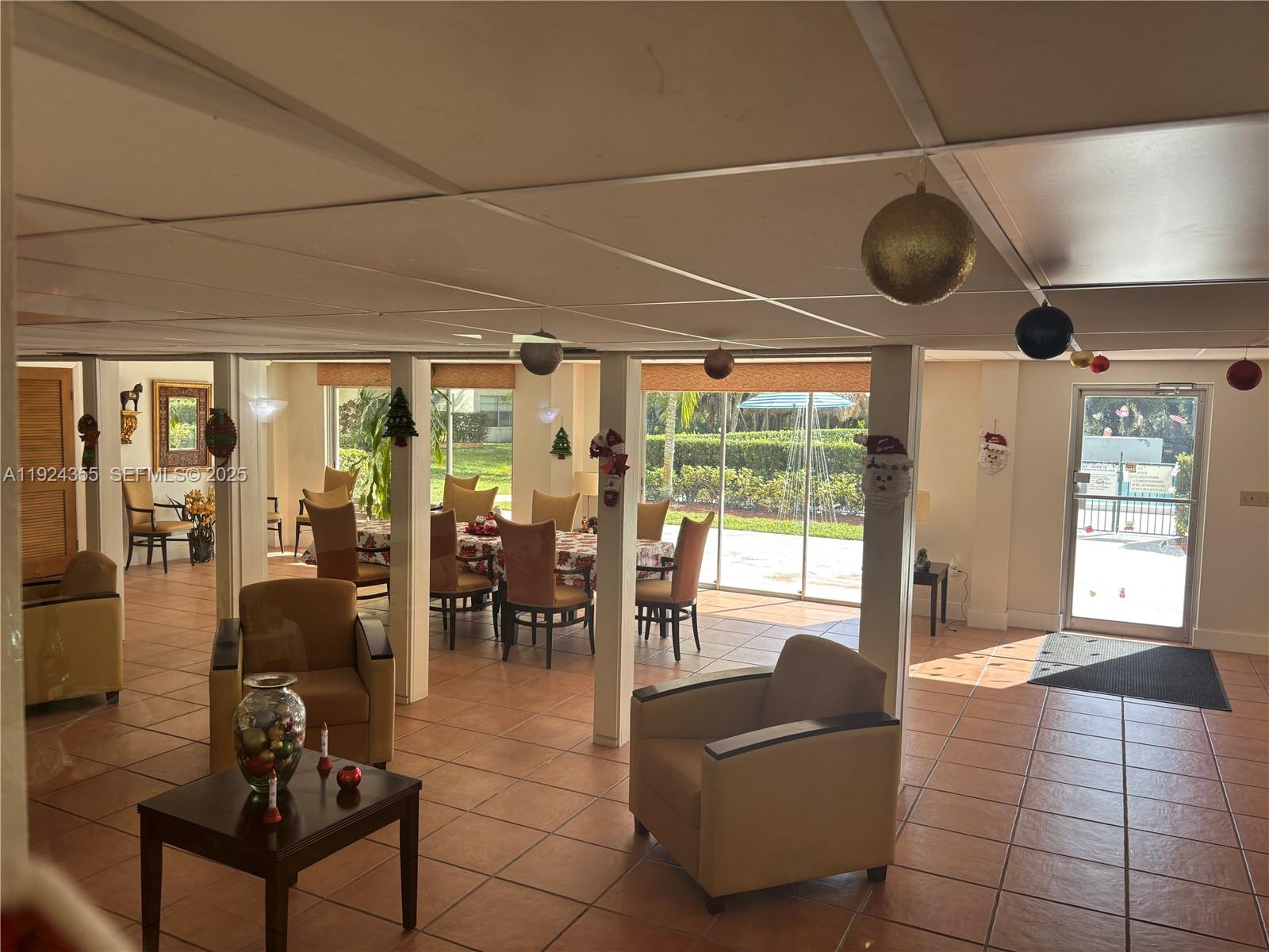 14250 Southwest 62nd Street, Unit 520 Miami, FL 33183 - Photo 34 of 39 a living room with furniture and a large window