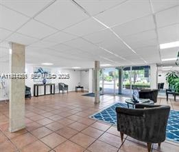 14250 Southwest 62nd Street, Unit 520 Miami, FL 33183 - Photo 36 of 39 a living room with furniture and a large window