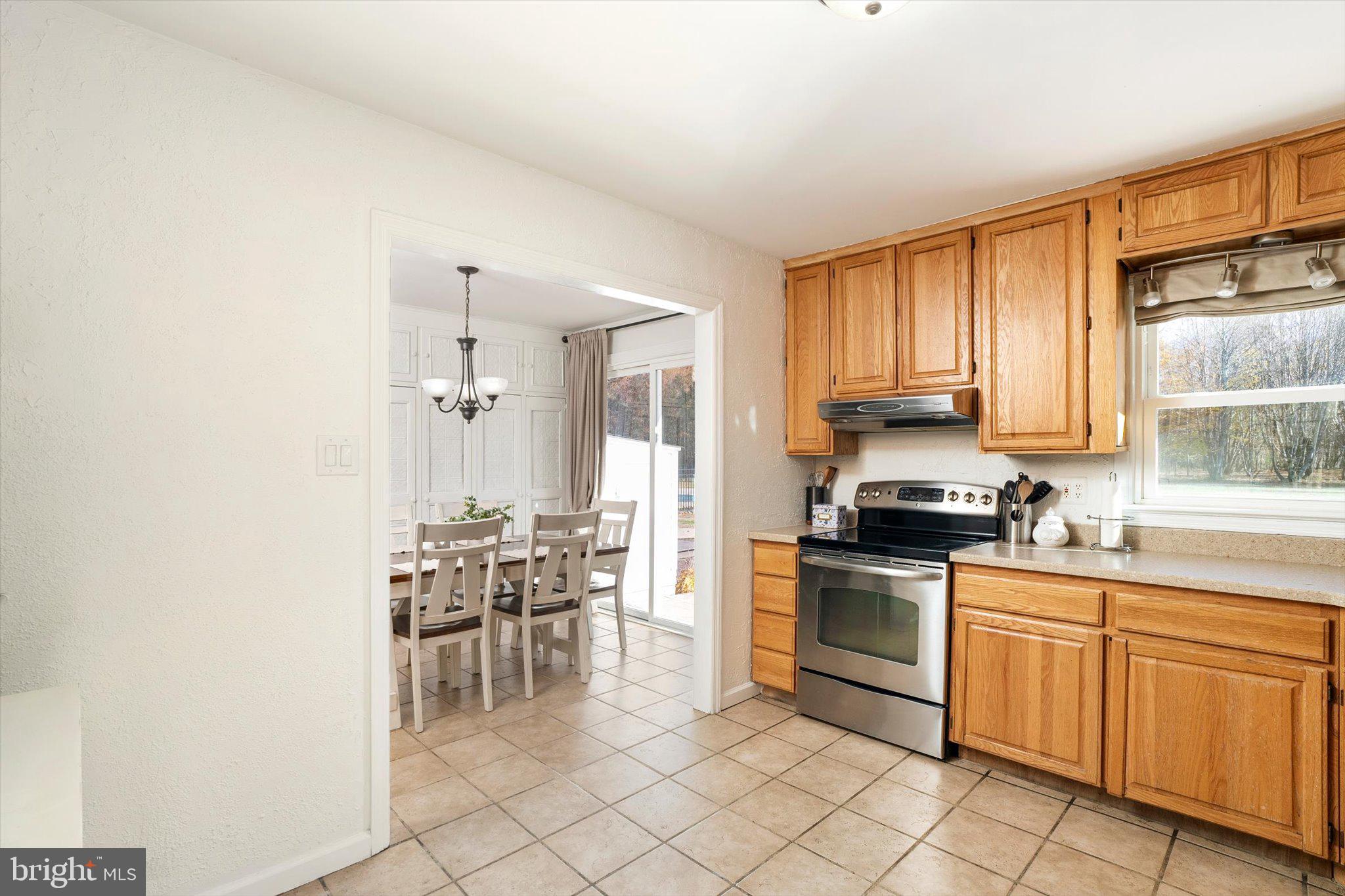 21 Holmes Mill Road Cream Ridge, NJ 08514 - Photo 12 of 37 a kitchen with granite countertop cabinets stainless steel appliances and a dining table