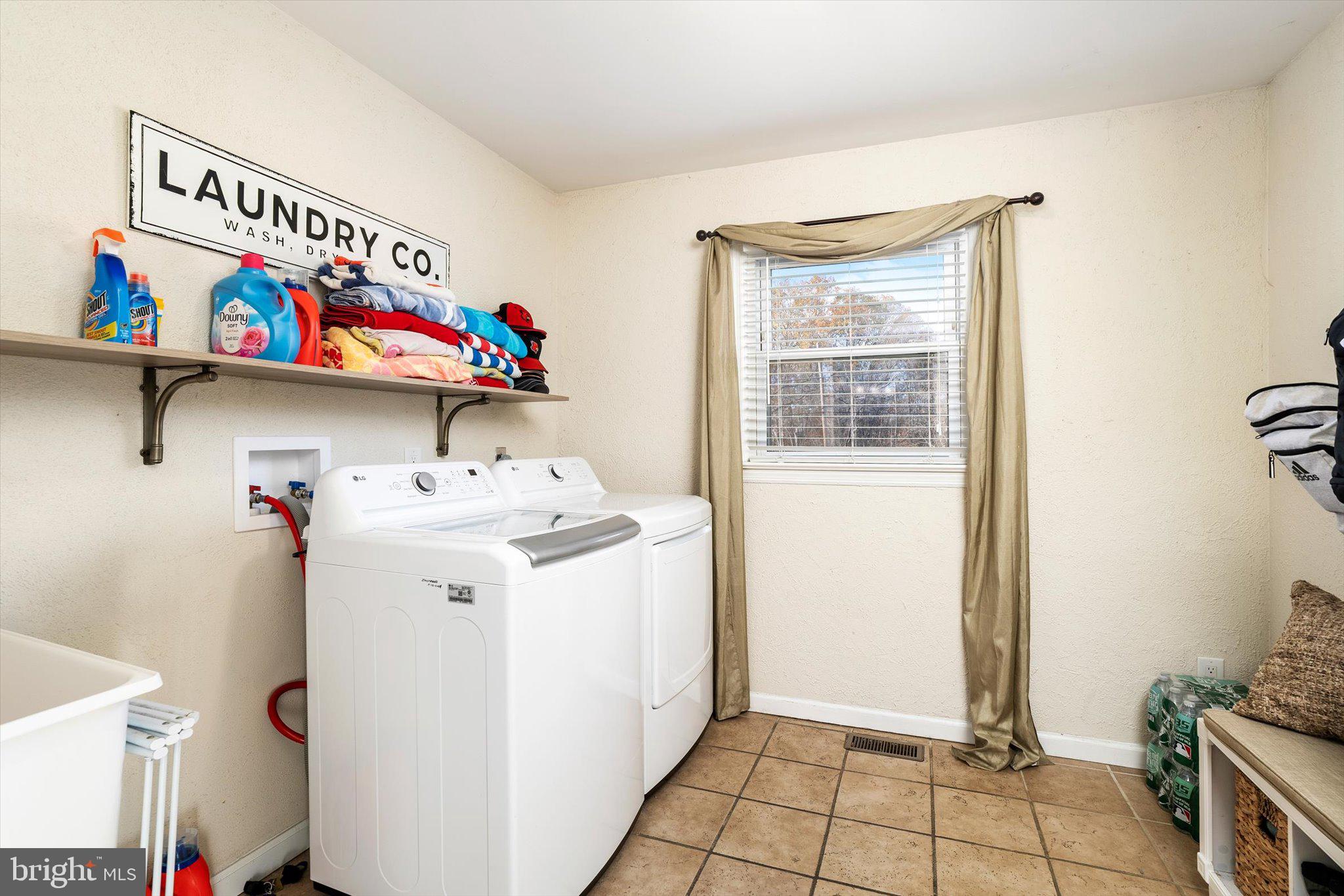 21 Holmes Mill Road Cream Ridge, NJ 08514 - Photo 17 of 37 a utility room with dryer and washer