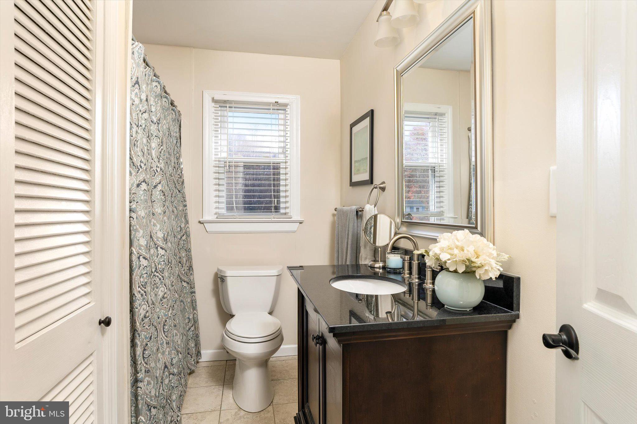 21 Holmes Mill Road Cream Ridge, NJ 08514 - Photo 19 of 37 a bathroom with a toilet a sink and a window