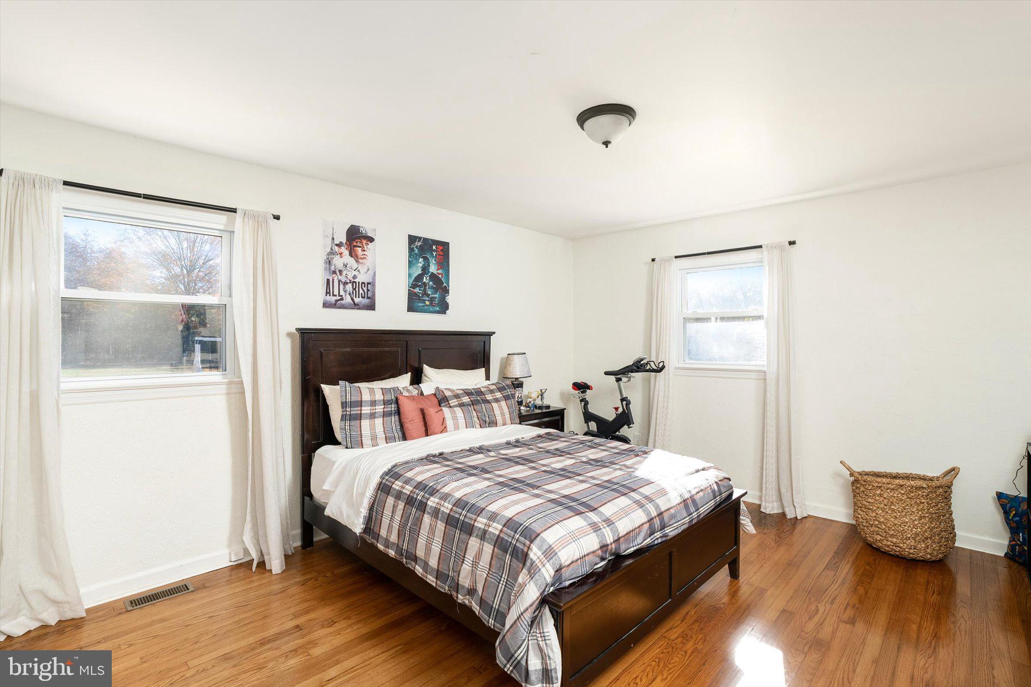 21 Holmes Mill Road Cream Ridge, NJ 08514 - Photo 20 of 37 a bedroom with a bed and wooden floor