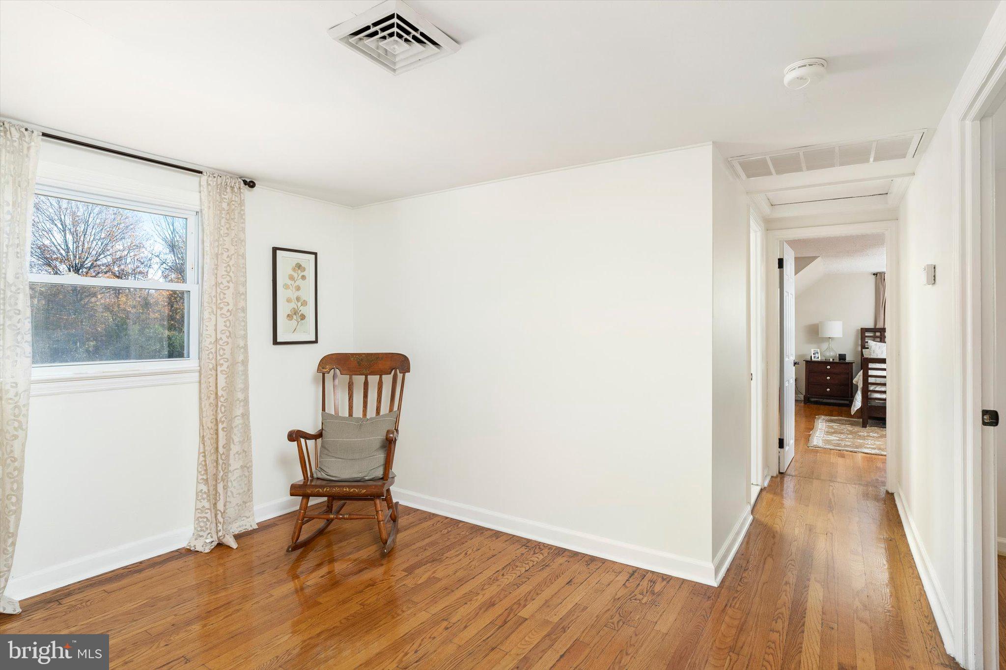 21 Holmes Mill Road Cream Ridge, NJ 08514 - Photo 21 of 37 a view of a hallway with wooden floor and furniture