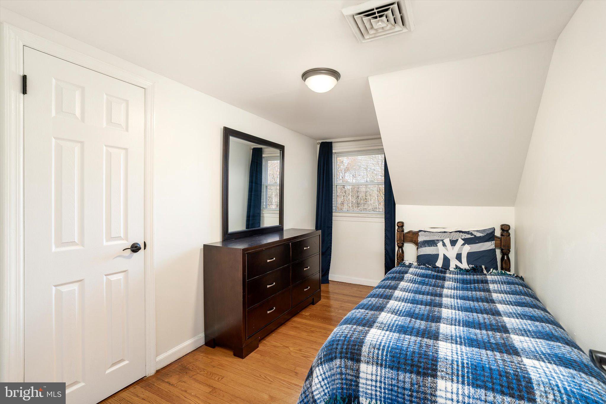 21 Holmes Mill Road Cream Ridge, NJ 08514 - Photo 24 of 37 a bedroom with a bed and wooden floor