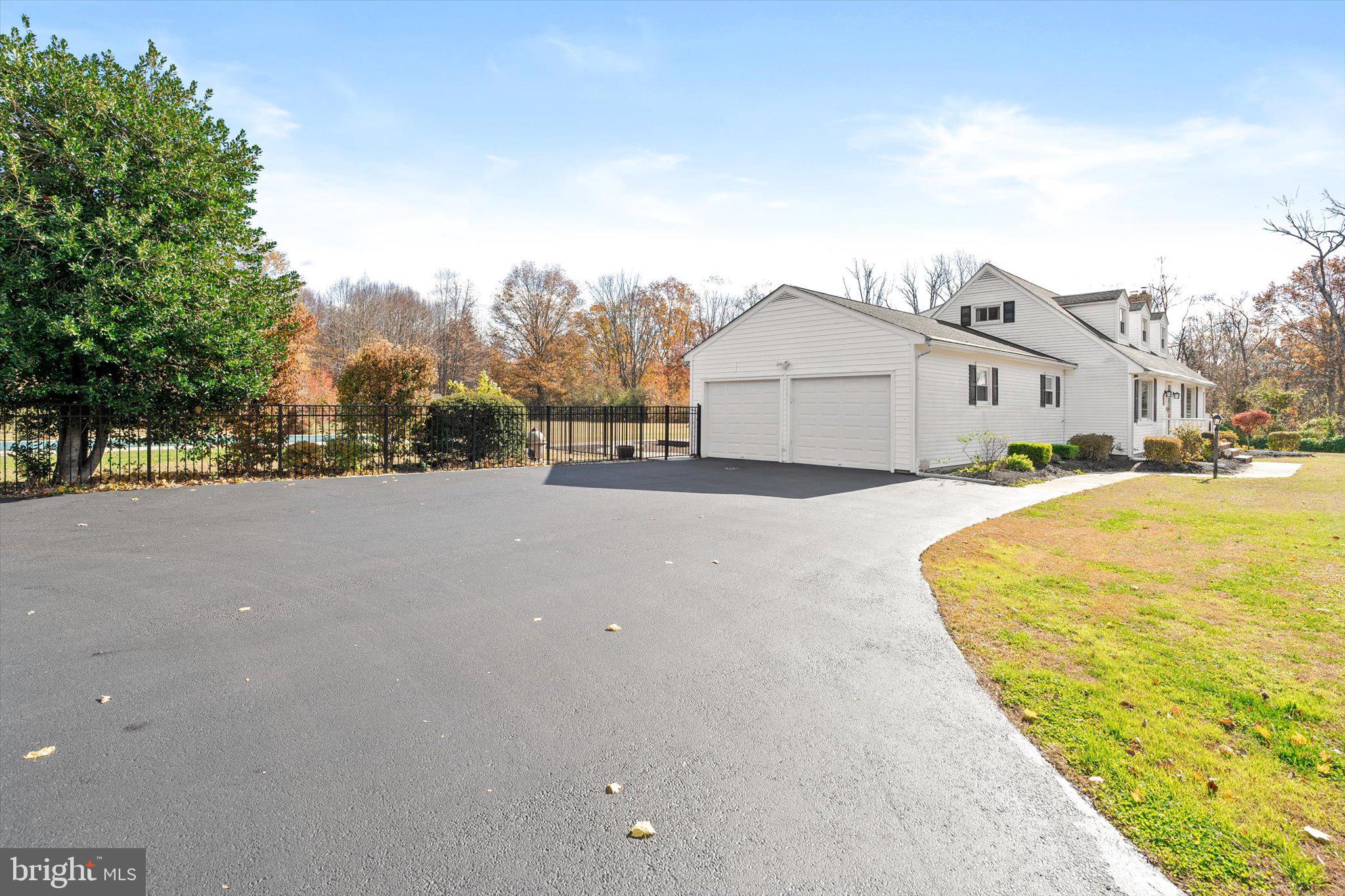 21 Holmes Mill Road Cream Ridge, NJ 08514 - Photo 3 of 37 a view of house with yard and trees in the background