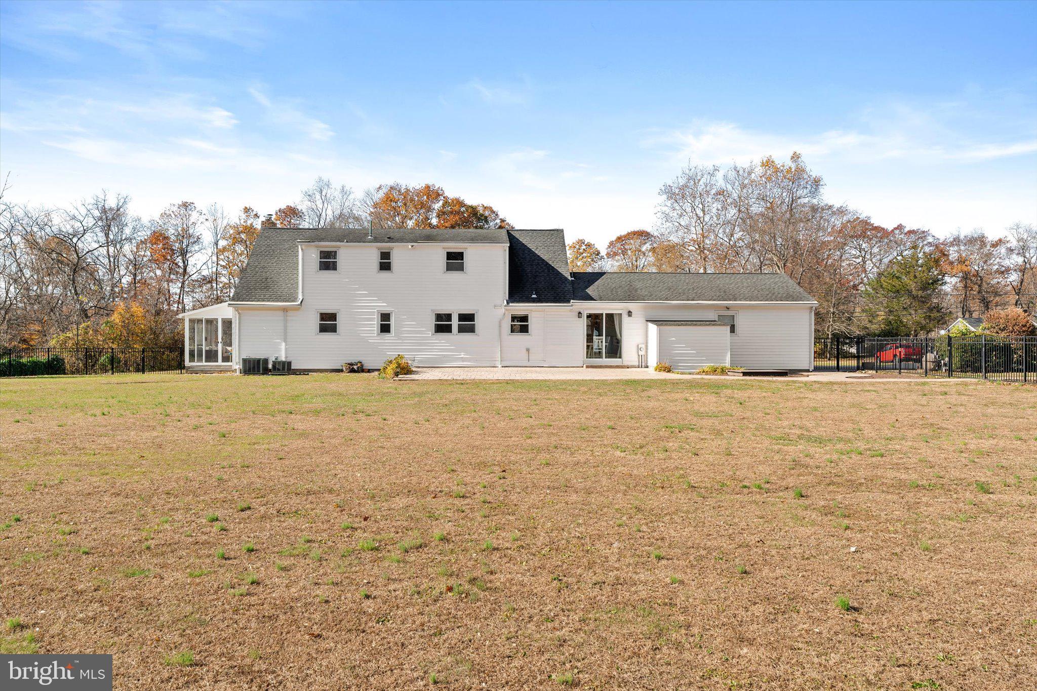 21 Holmes Mill Road Cream Ridge, NJ 08514 - Photo 35 of 37 a large white house with a big yard and large trees