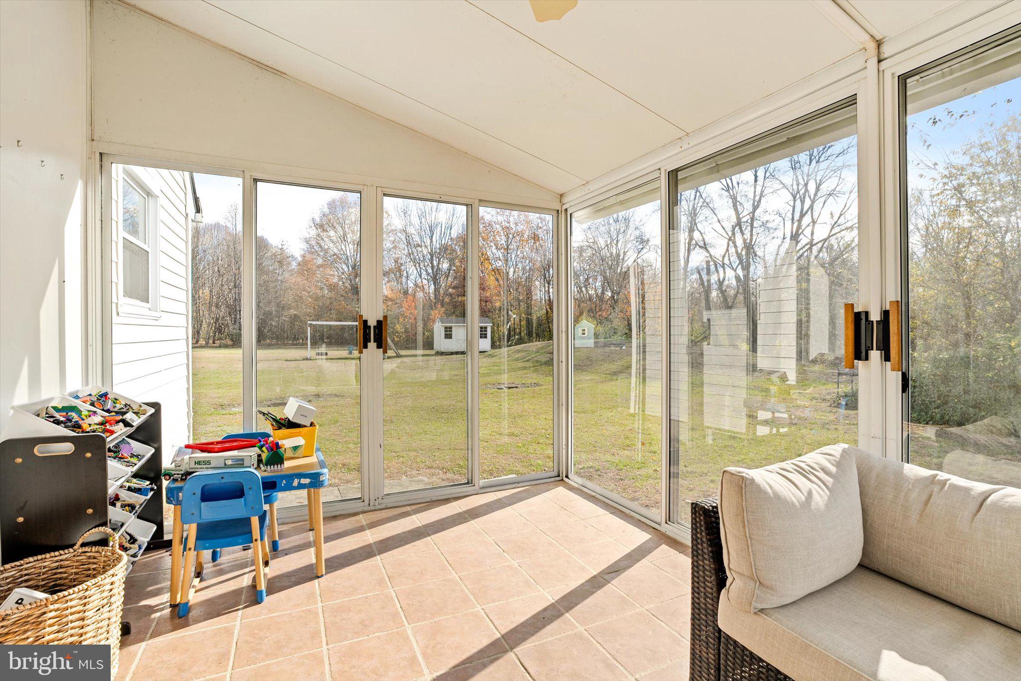 21 Holmes Mill Road Cream Ridge, NJ 08514 - Photo 10 of 37 a living room with furniture and floor to ceiling windows