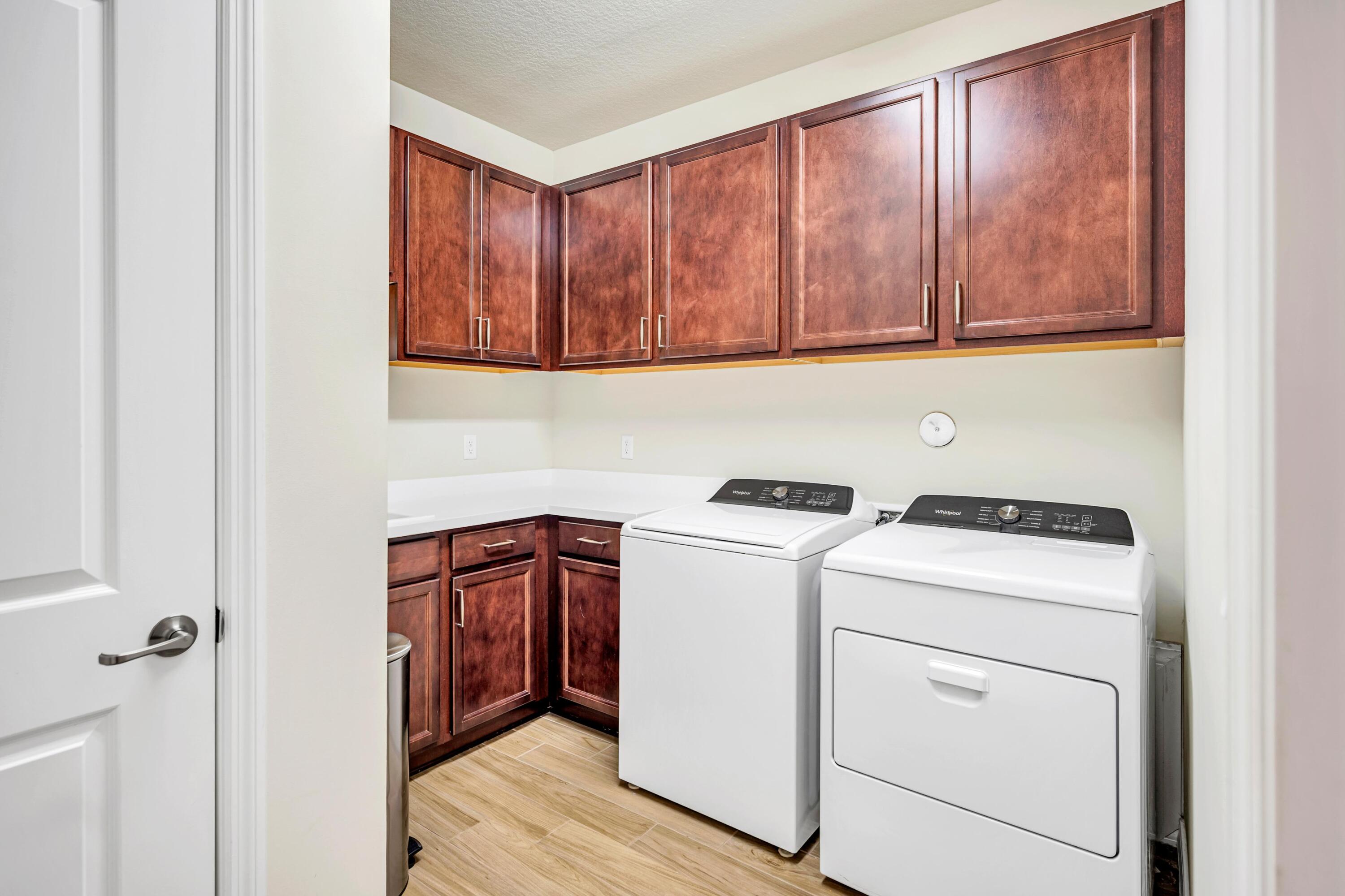 8028 Northwest 78th Street Tamarac, FL 33321 - Photo 24 of 38 a utility room with dryer and washer