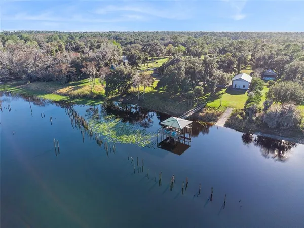 a view of a lake with a big yard