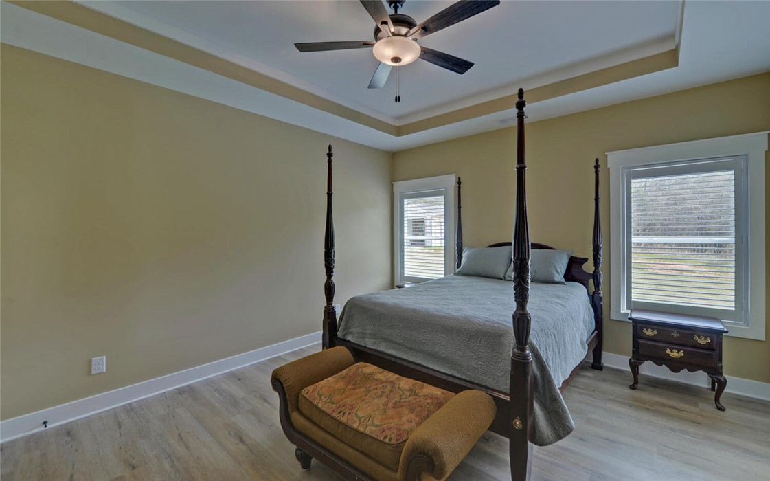 111 Topher Street Hartwell, GA 30643 - Photo 17 of 38 This tranquil bedroom features recessed lighting and durable flooring, creating a peaceful retreat.