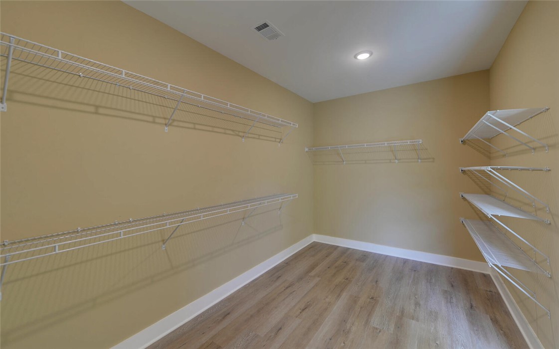 111 Topher Street Hartwell, GA 30643 - Photo 21 of 38 This spacious closet offers organized storage solutions with wire shelving.