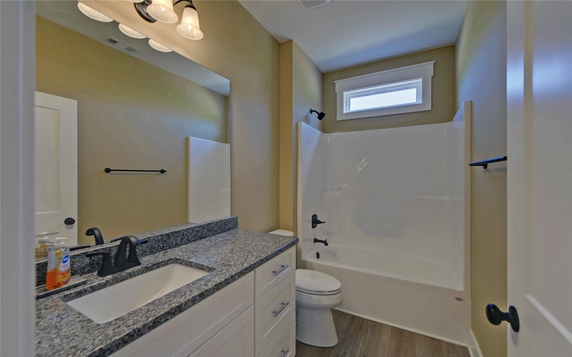 111 Topher Street Hartwell, GA 30643 - Photo 26 of 38 This bright bathroom features a spacious vanity and a combination shower and tub.
